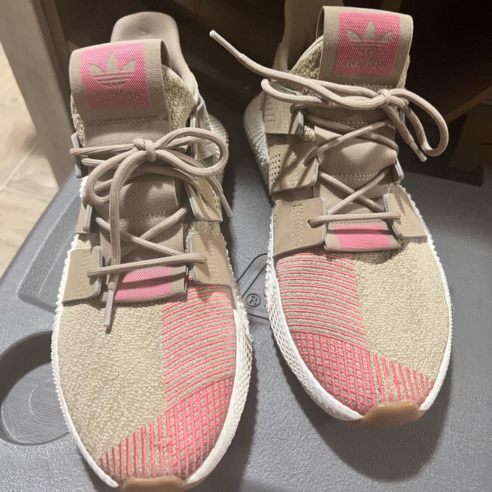 Men’s size 10 adidas tubular tennis shoes.